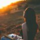 Girl in field, journal